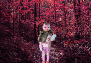 Dziewczynka przebrana za kota w tle różowy las